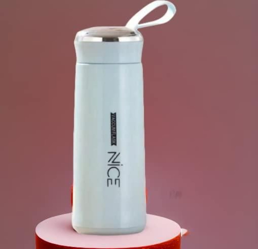 Light blue thermos with 'NICE' branding on a pink stand against a red background