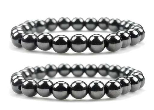 Two black beaded bracelets on a white background