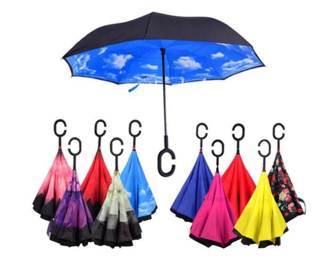 Set of colorful inverted umbrellas with C-shaped handles on a white background