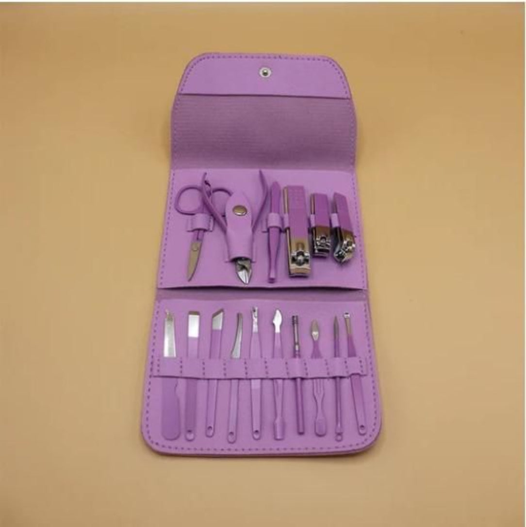 Purple manicure set with tools on a beige background