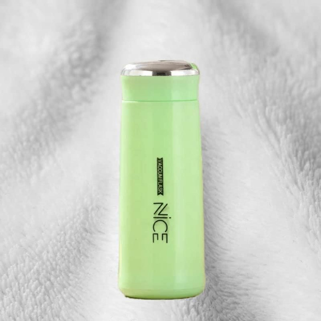 Green thermos bottle with 'NICE' branding on a textured gray background