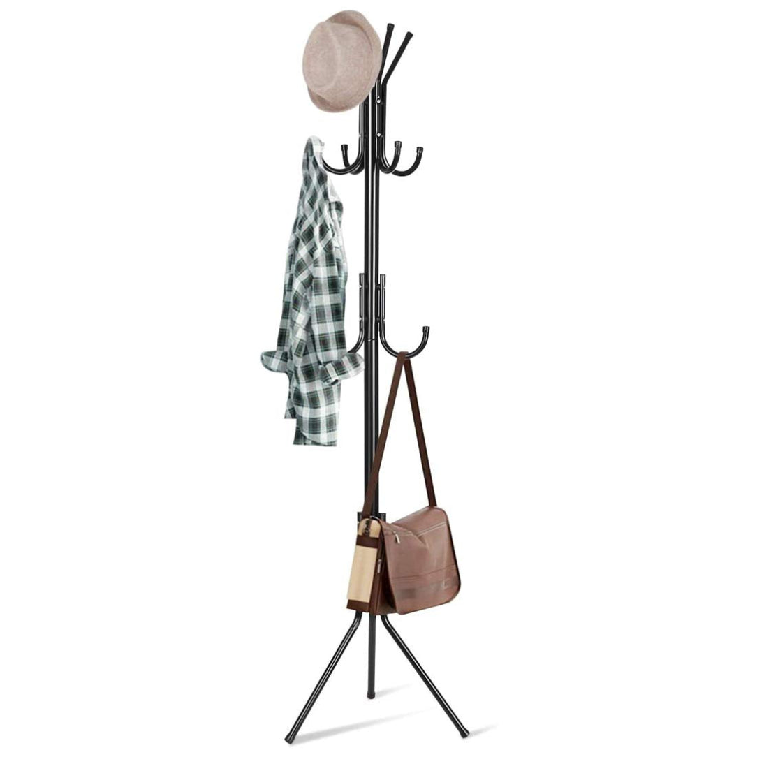 Black metal coat rack with a hat, jacket, and handbag on a white background