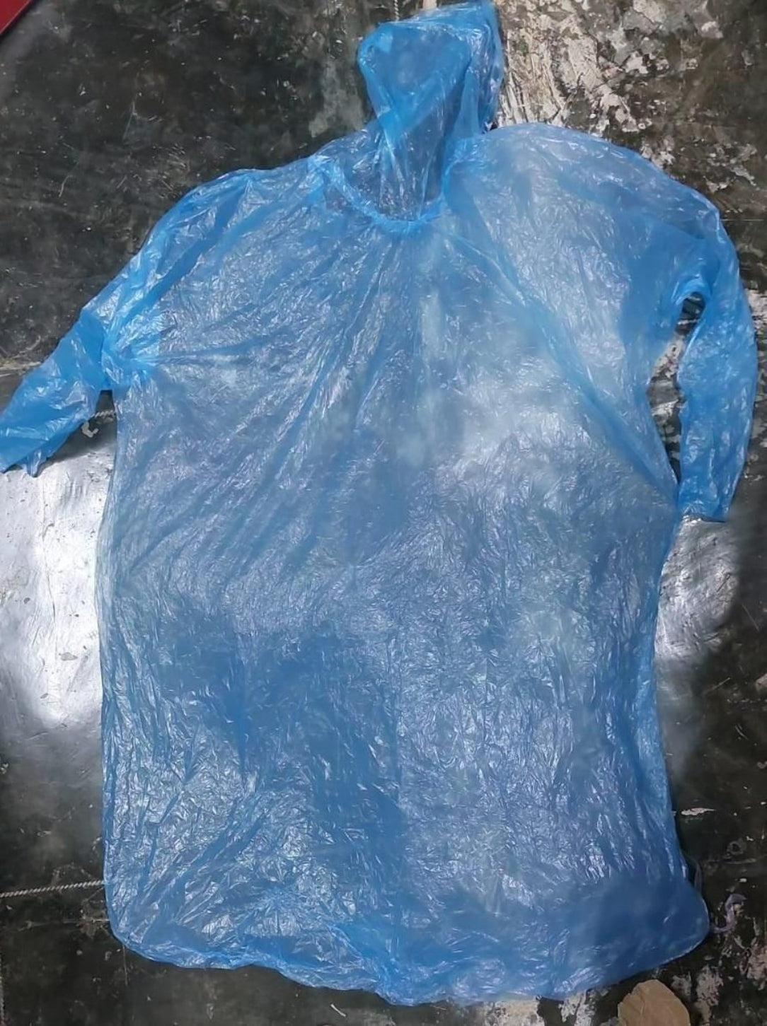 Blue plastic bag on a dark surface