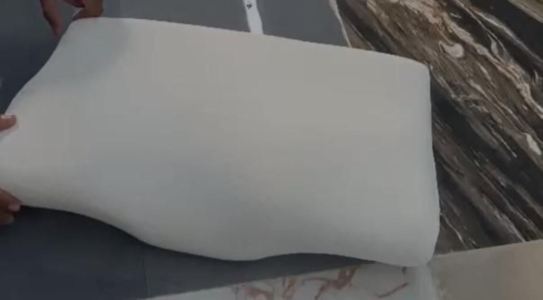 White pillow on a marble surface