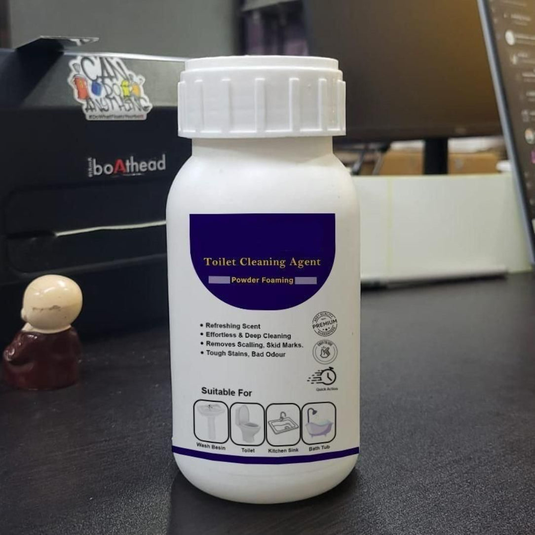 White bottle of toilet cleaning agent on a desk with a blurred background