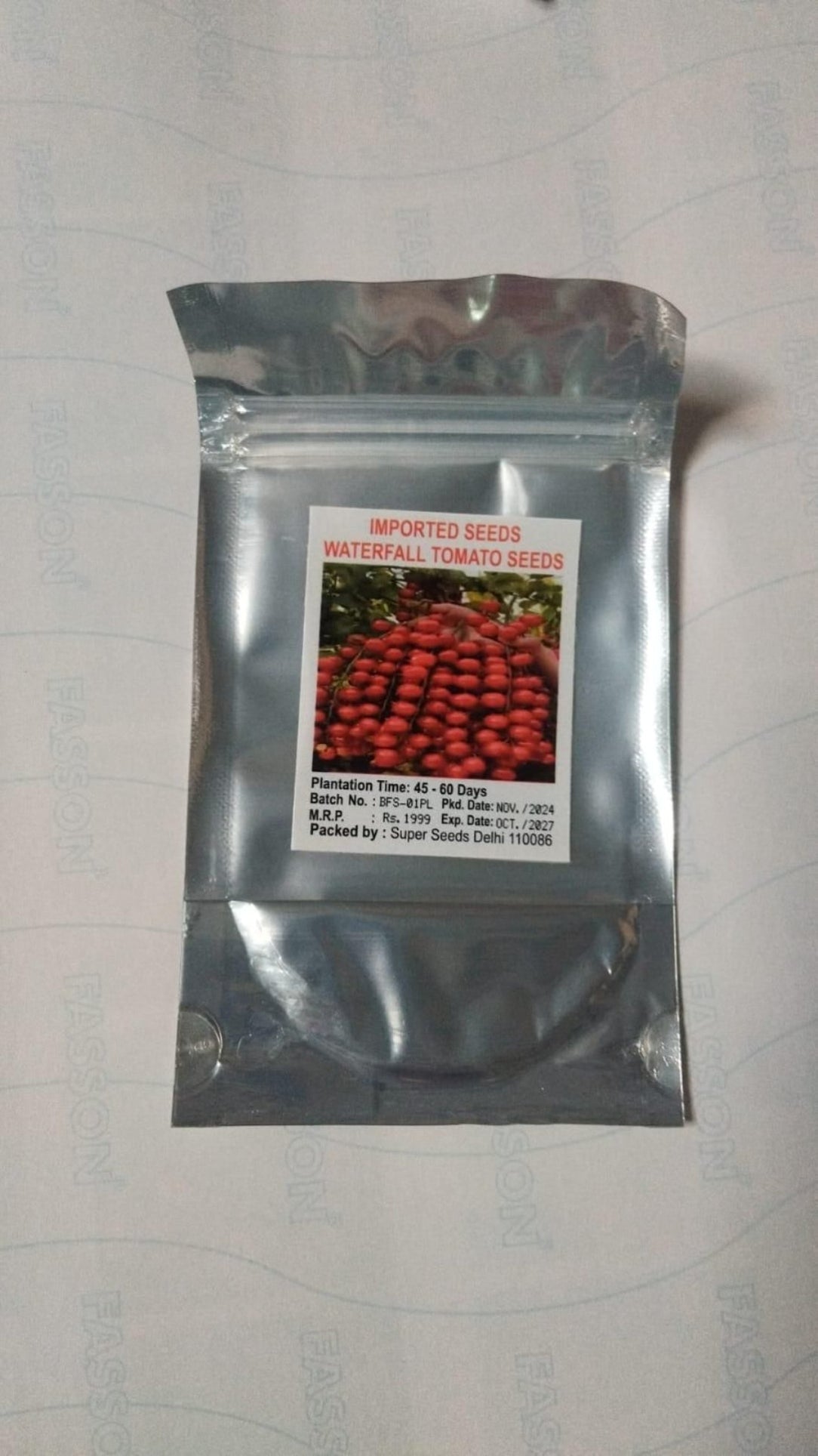 Seeds packet with tomato seeds on a white background