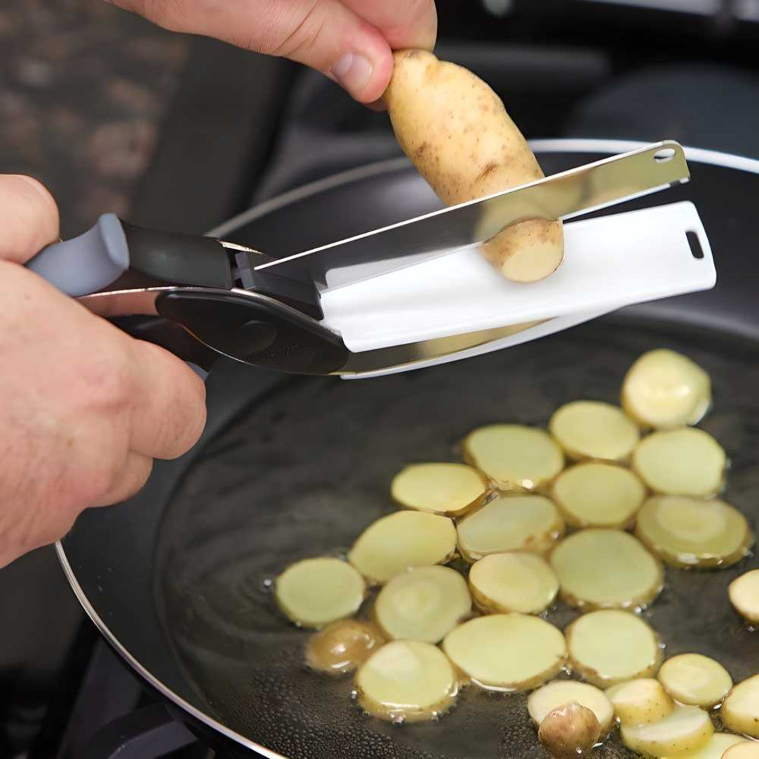 Person using a potato peeler to slice potatoes into a frying pan.