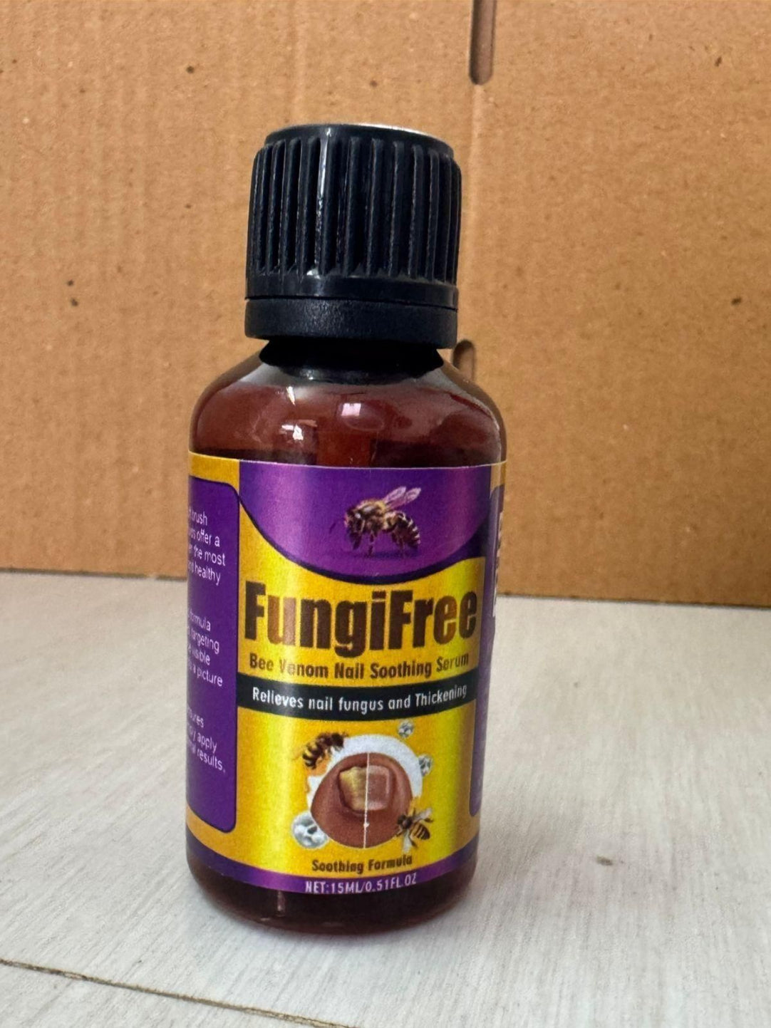 Bottle of FungiFree product on a cardboard background