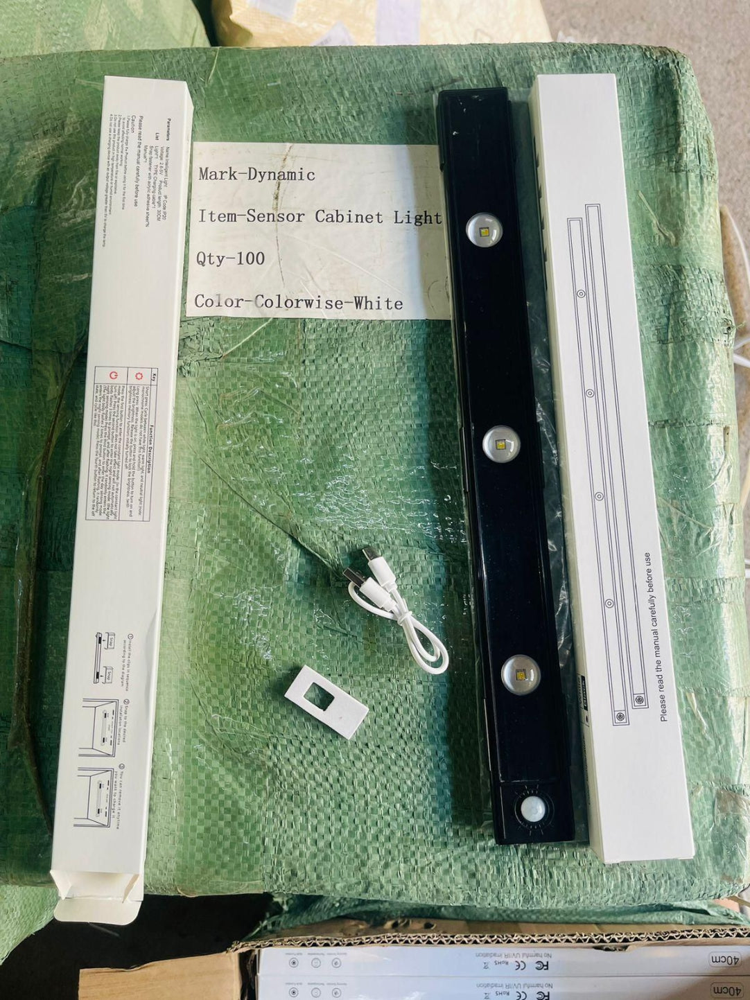 Packaged item with labels on a green surface
