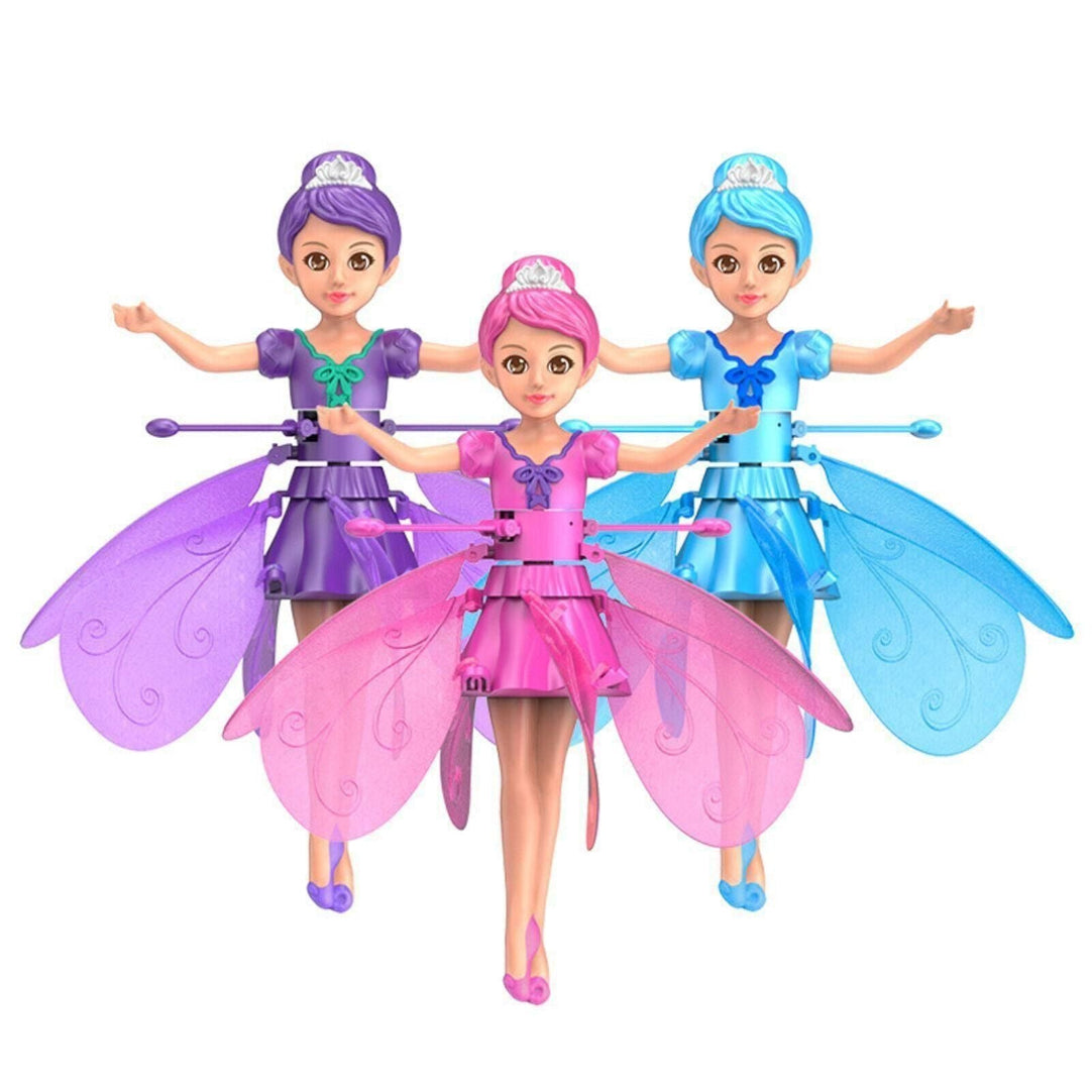 Three fairy dolls with colorful wings on a white background