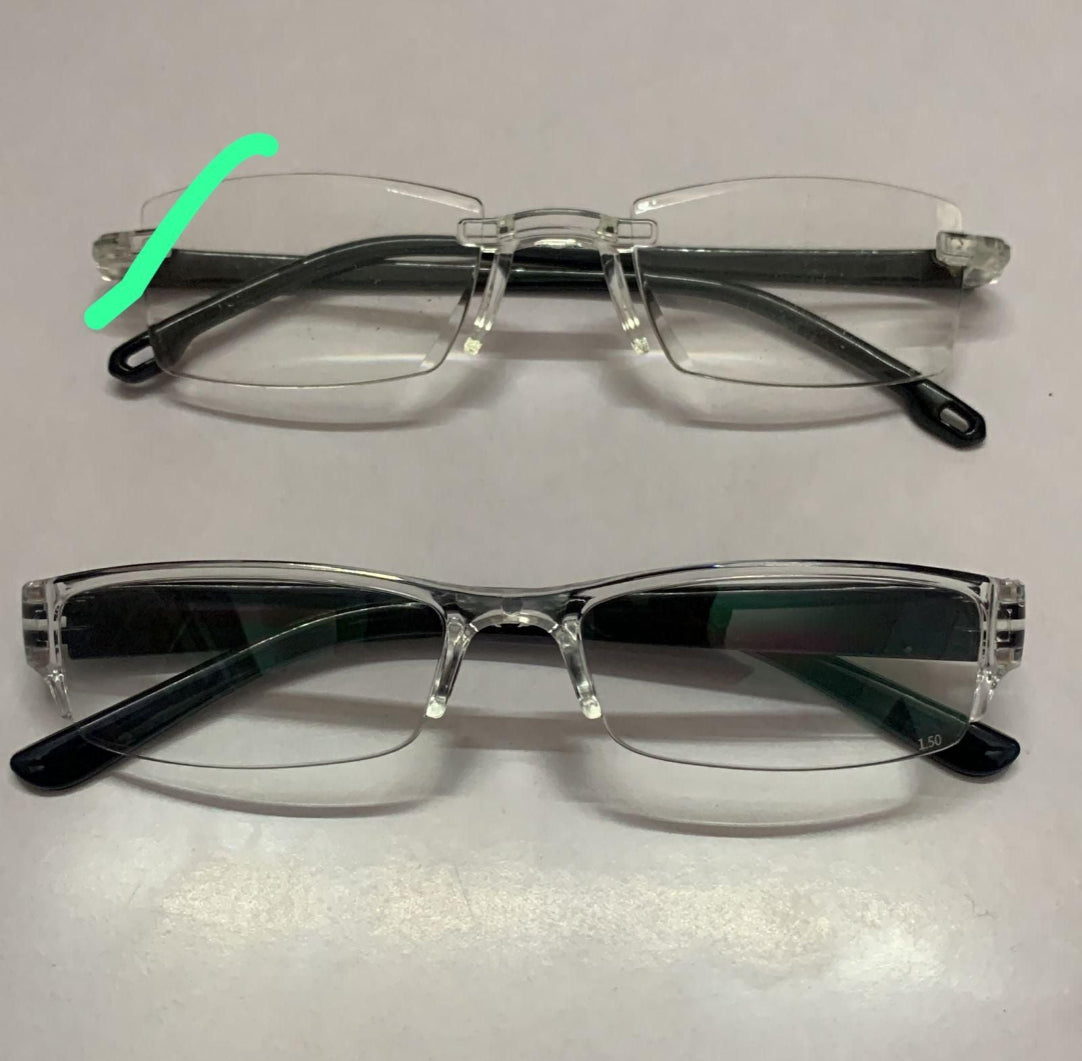 Two pairs of clear rimless eyeglasses on a light gray background