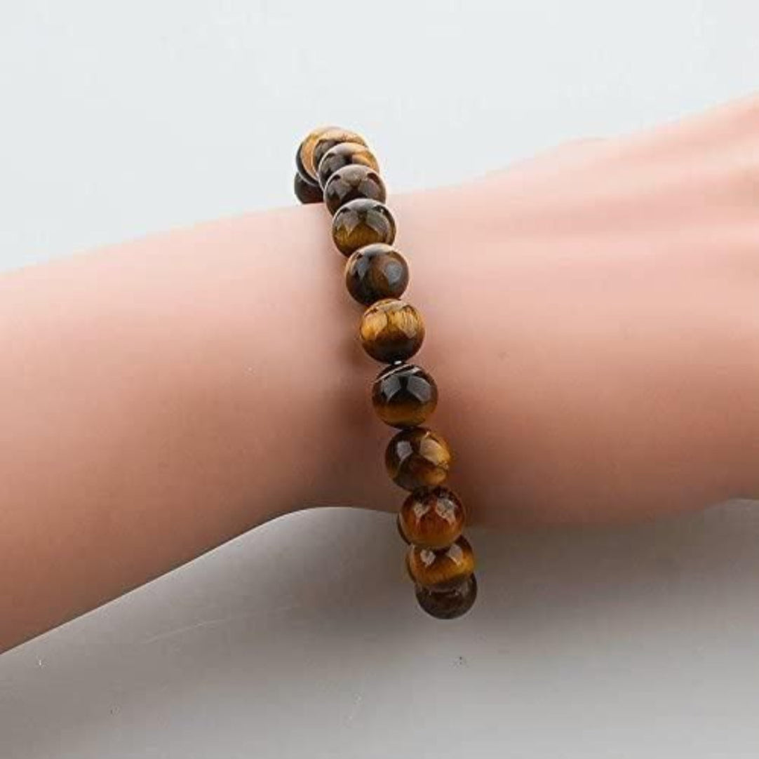 Beaded bracelet on a wrist against a neutral background