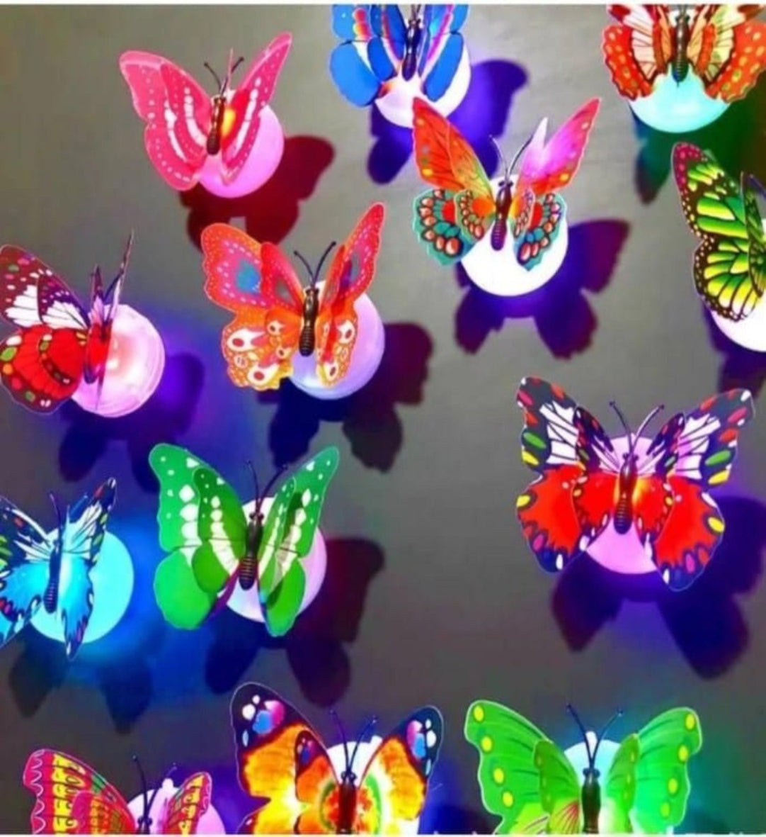 Colorful butterfly-shaped lights on a reflective surface