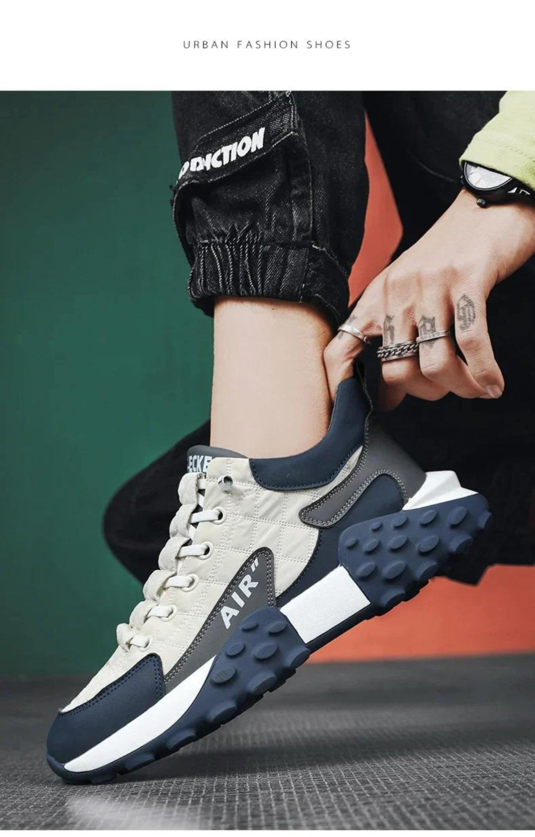 Person wearing a beige and navy sneaker with 'AIR' branding on a blurred background.