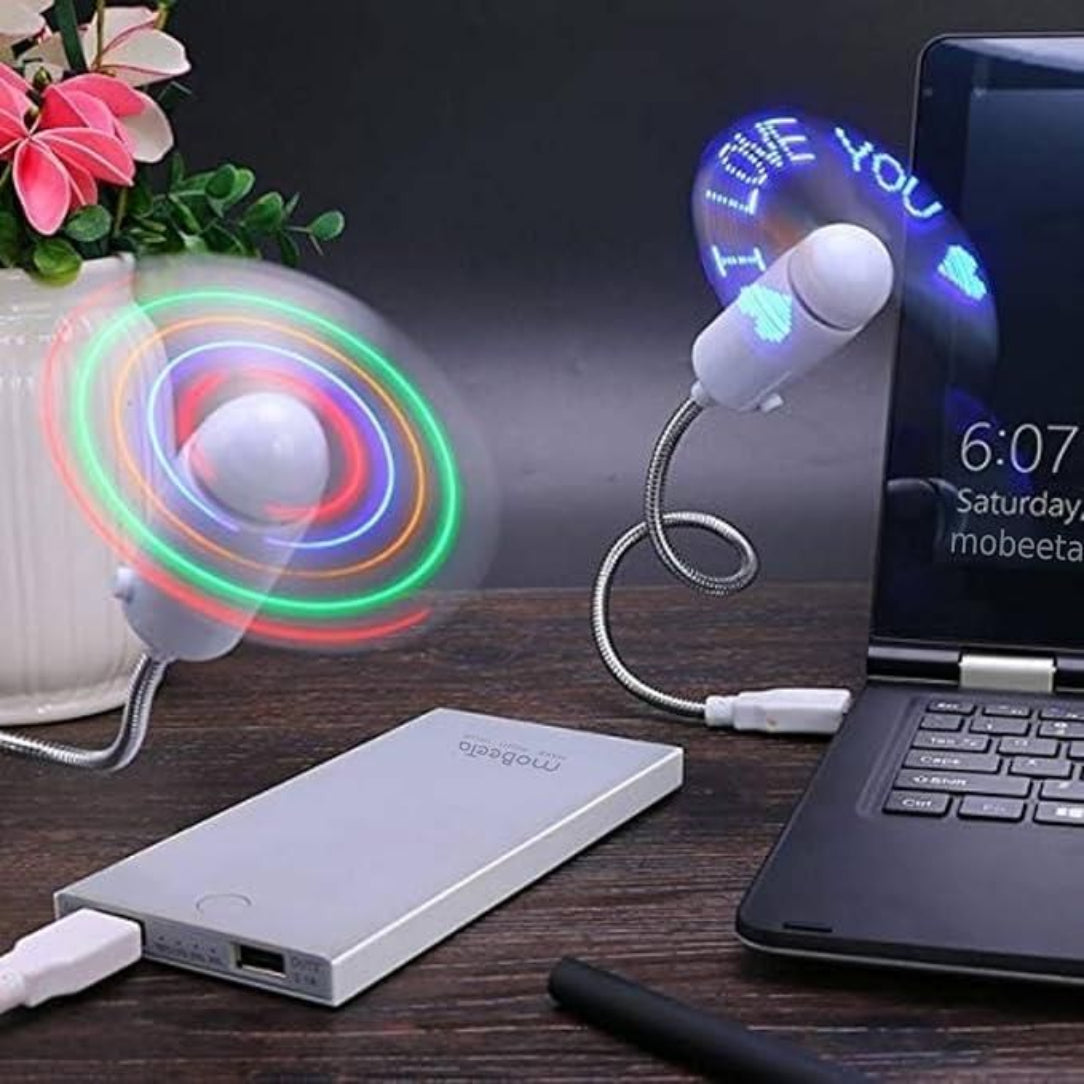 Two USB fans on a desk with a laptop and power bank.
