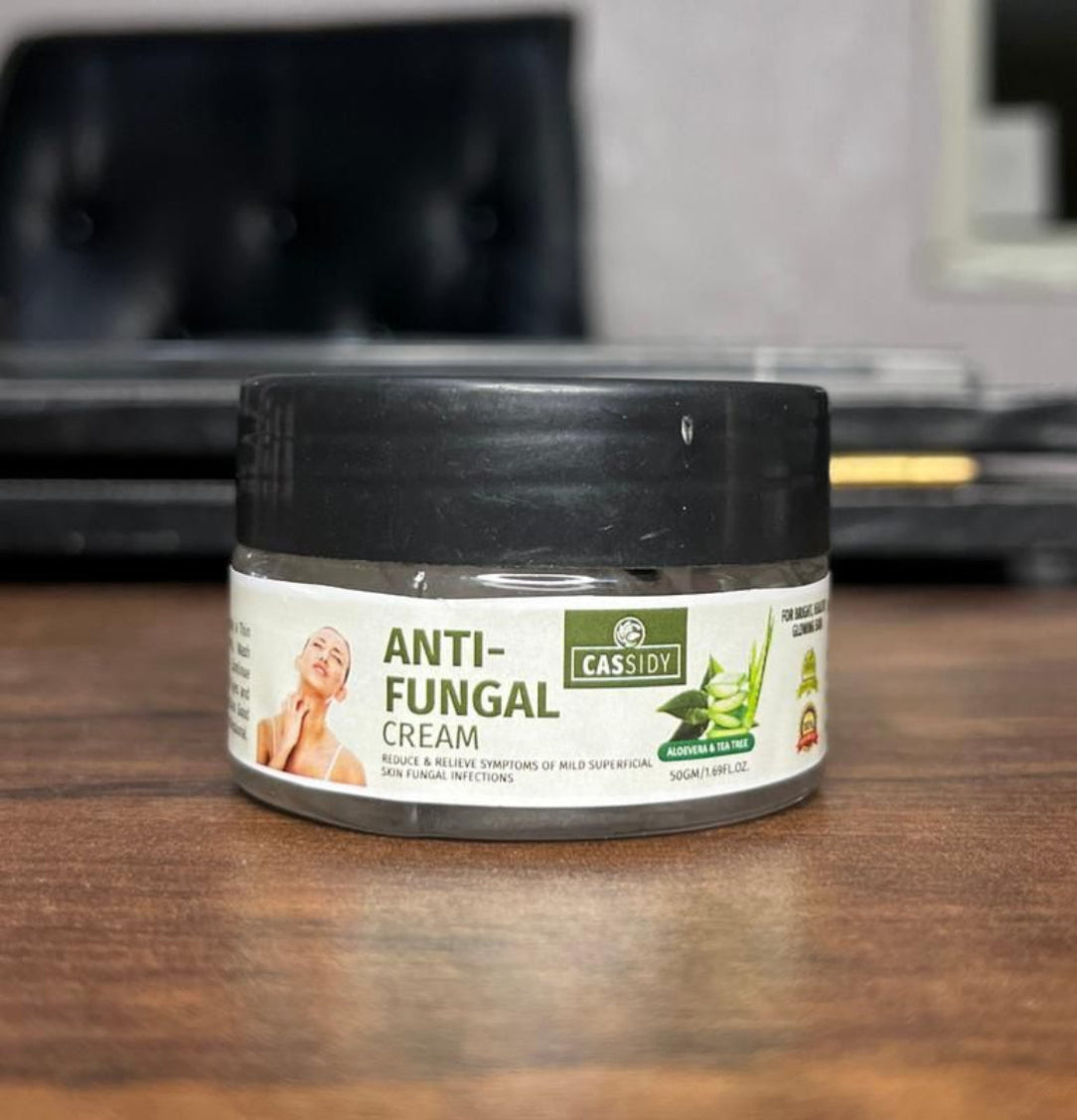 Anti-fungal cream jar on a wooden surface with a blurred background