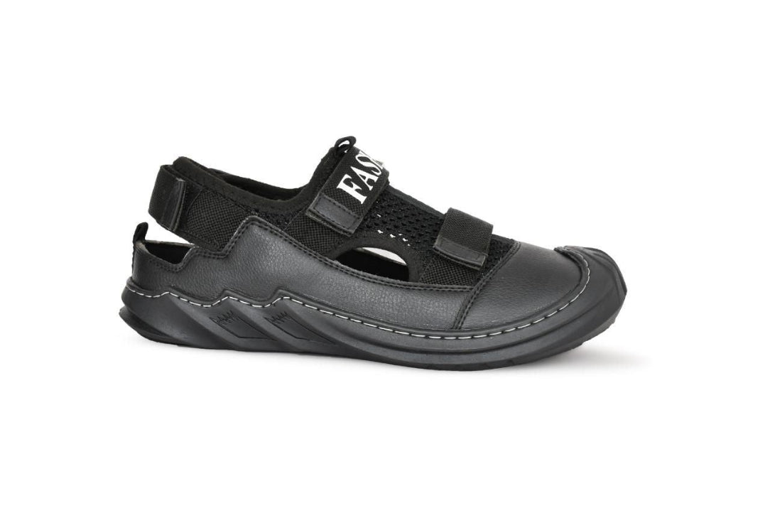 Black sandal with velcro straps on a white background