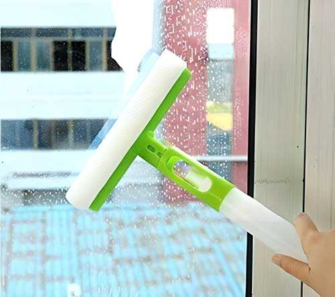 A green and white window cleaning tool with a spray bottle attached to a squeegee.