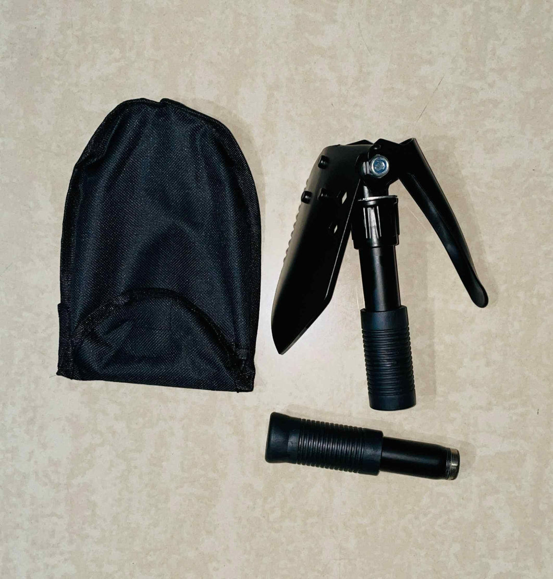 Black folding tool and carrying case on a beige surface