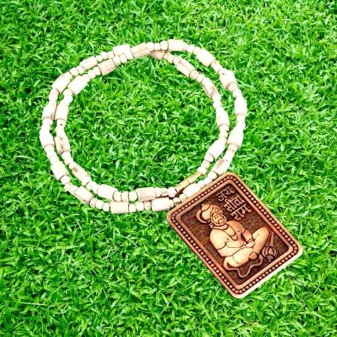 Bracelet with a Buddha pendant on grass