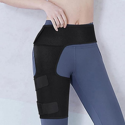 A person wearing a black hip brace with adjustable straps over a blue activewear pants.