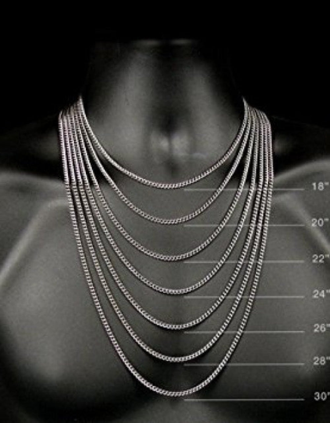 Set of silver chain necklaces displayed on a mannequin with measurement scale.