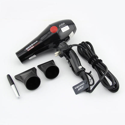 Black hair dryer with attachments on a white background