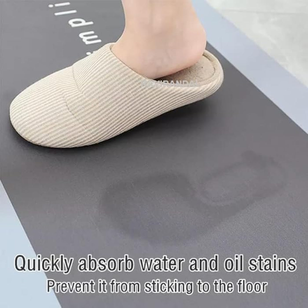 Beige slipper on a gray mat with text about absorbing water and oil stains.