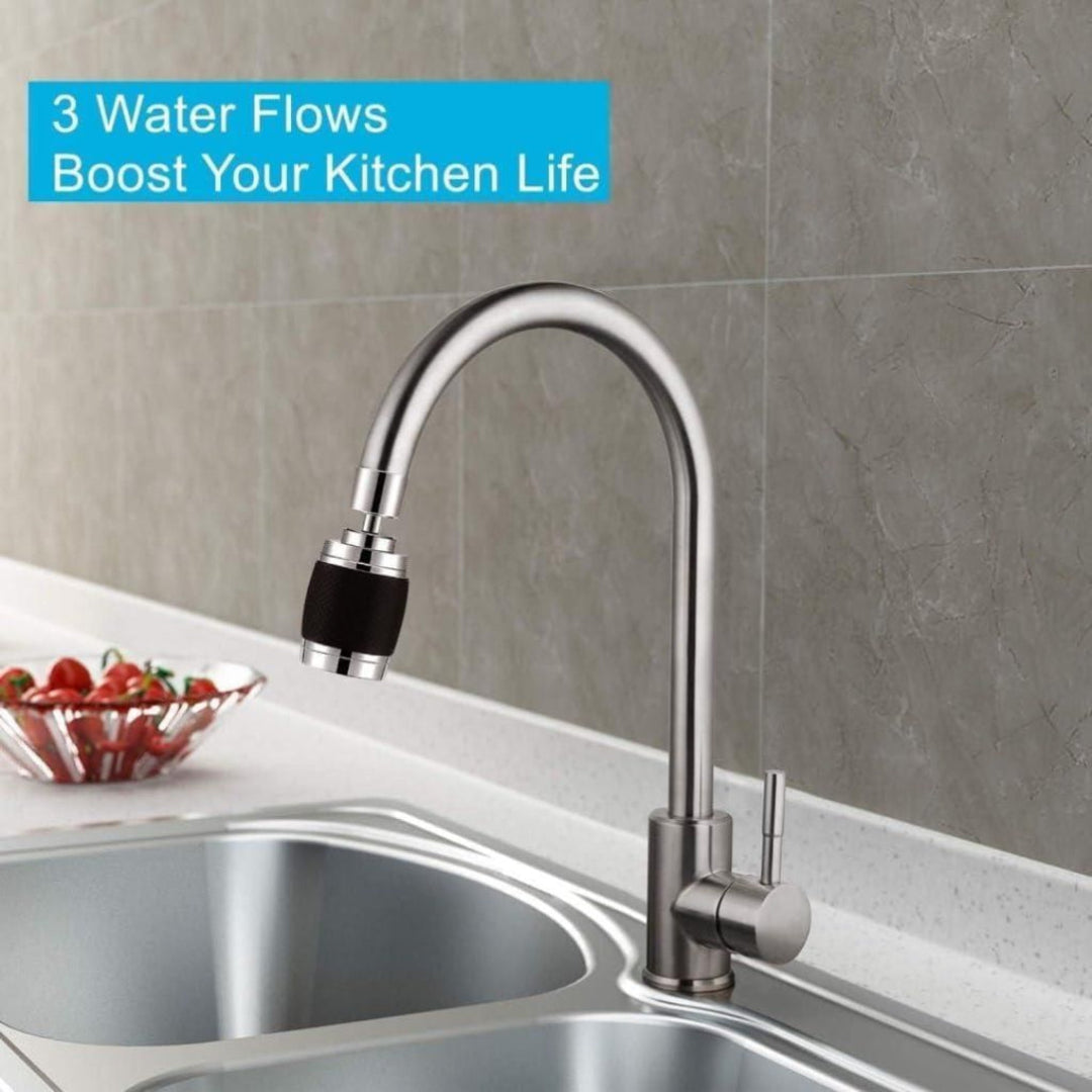 Modern kitchen faucet with three water flows on a gray tiled wall background.