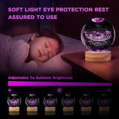 Glass ball with starry design on a wooden base next to a sleeping person, with text about soft light eye protection.