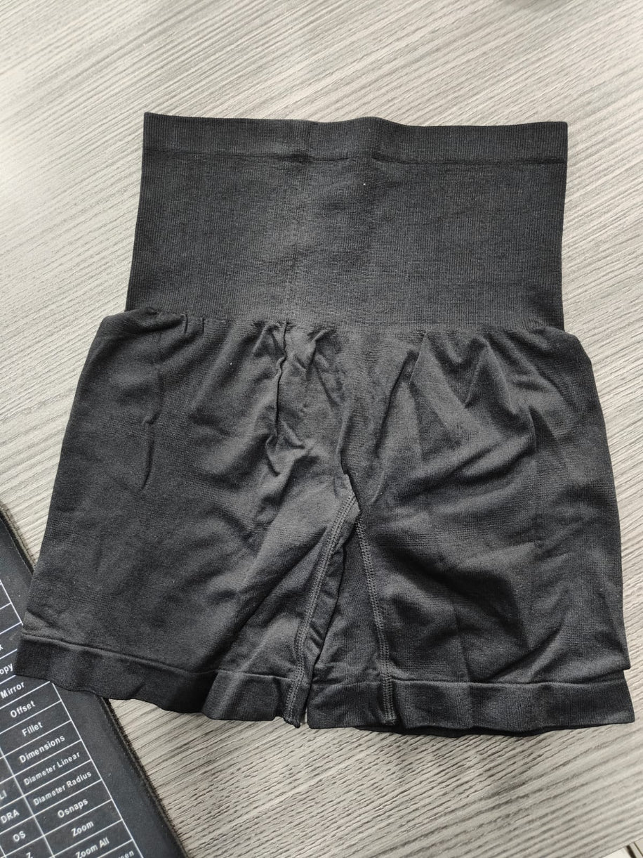 Black shorts on a textured surface