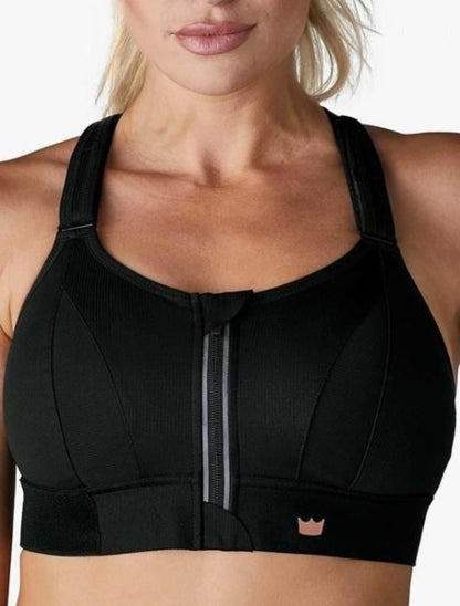 Black sports bra worn by a person on a white background