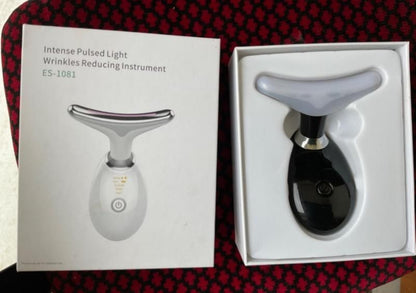 Intense Pulsed Light Wrinkles Reducing Instrument ES-1081 with packaging on a red and black checkered background.