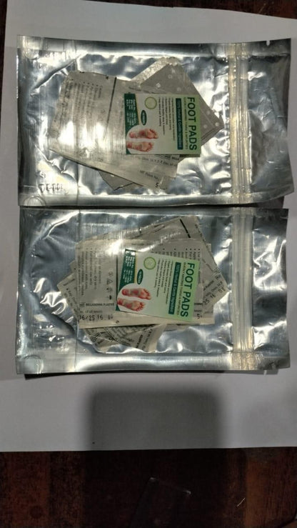 Two packages of foot pads on a white background