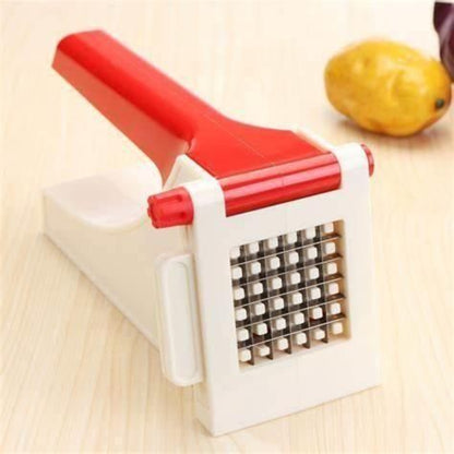 Red and white vegetable chopper on a wooden surface with a potato in the background