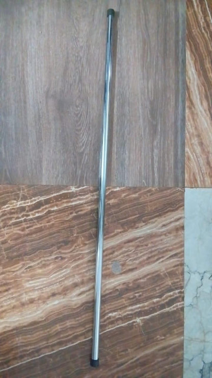 Metal rod on a textured surface with brown and beige tones