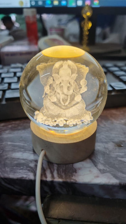 Decorative lamp with a figurine inside on a desk