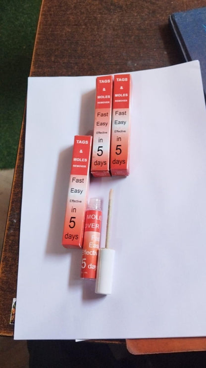 Small red and white containers with text on a white surface