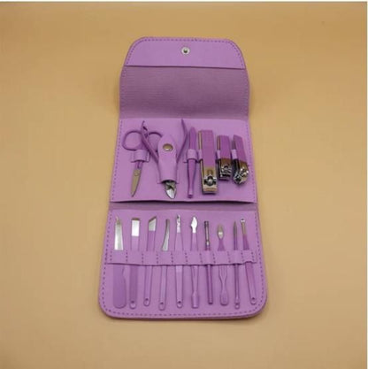 Purple manicure set with tools on a beige background