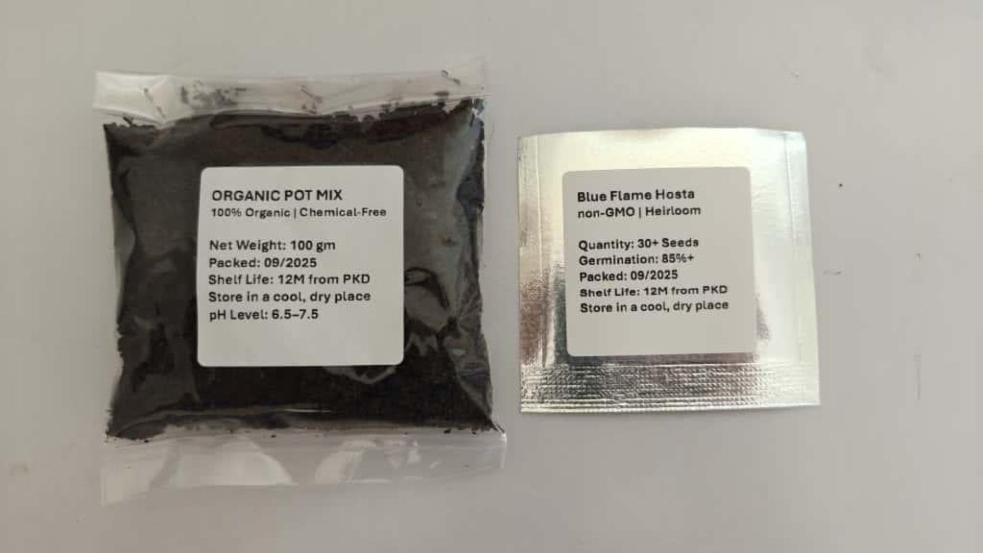 Two packages of black powder with labels on a white background