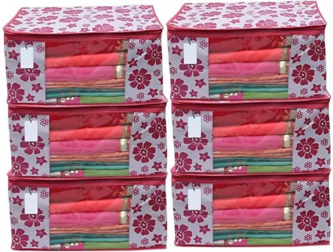 Stack of colorful folded fabrics in floral-patterned storage bags.