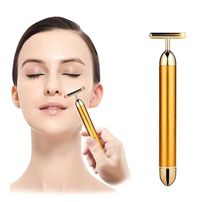 Woman using a gold facial roller on her face with a close-up of the device on a white background.