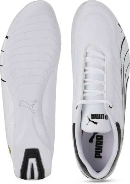White Puma shoes with black accents on a white background