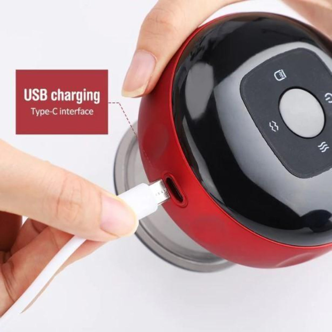 Red electronic device being charged with a USB cable, on a white background.