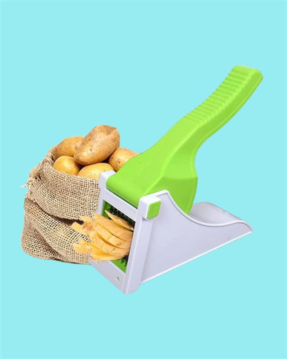 Green and white potato peeler with potatoes on a blue background