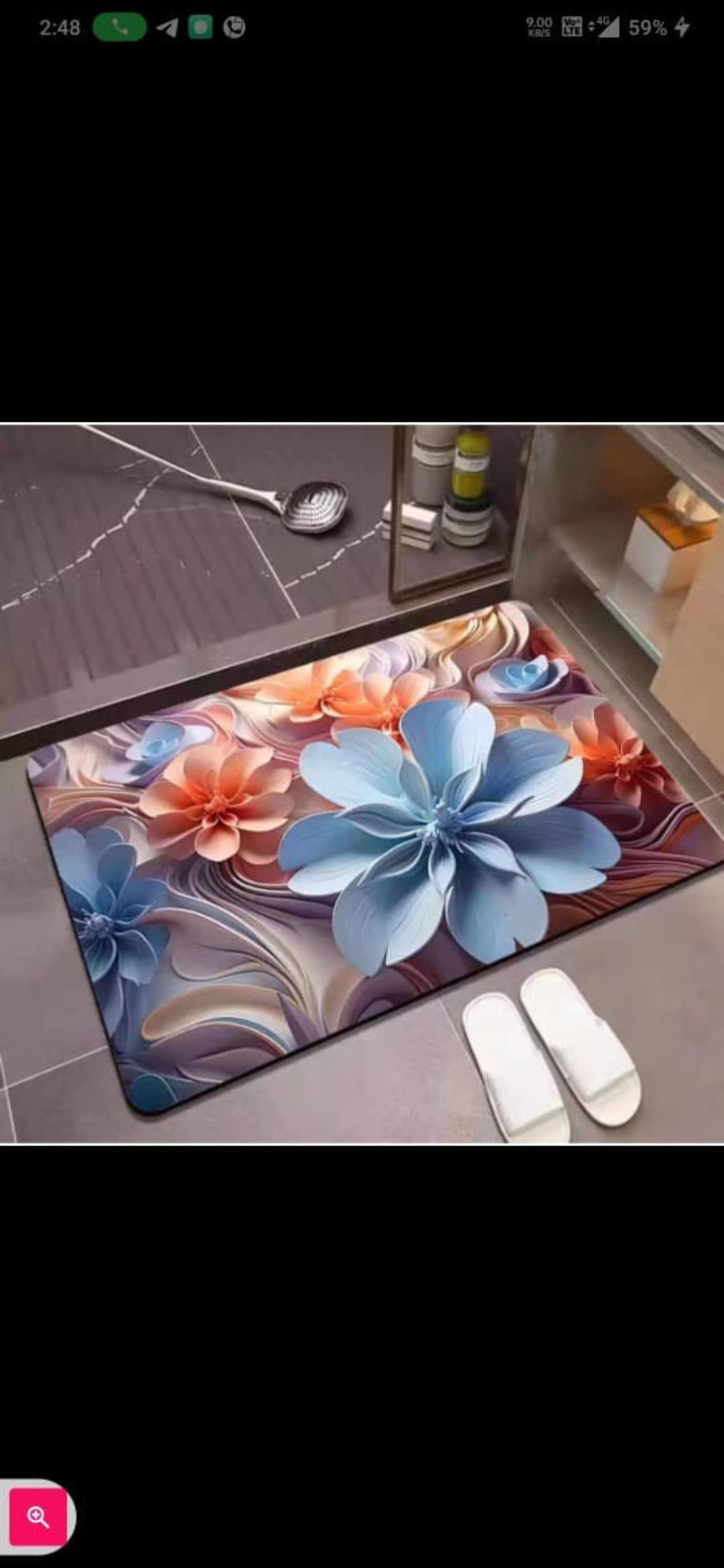 Decorative floral mat on a floor with slippers nearby