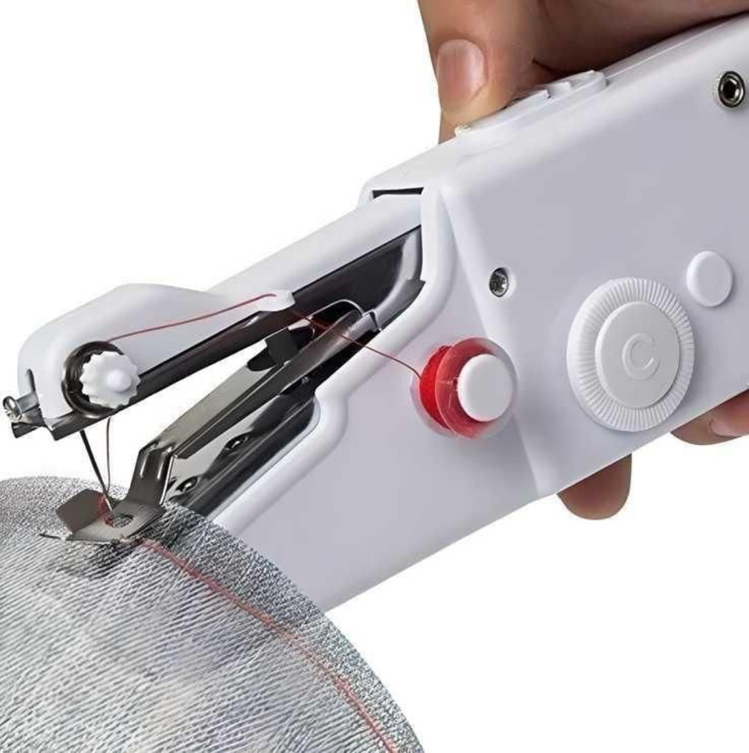Handheld sewing machine in use on a white background