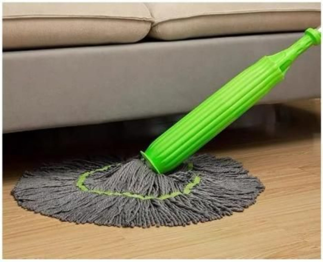 Green and gray mop cleaning under a beige sofa.