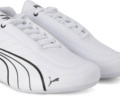 White sneakers with black accents and Puma logo on a white background
