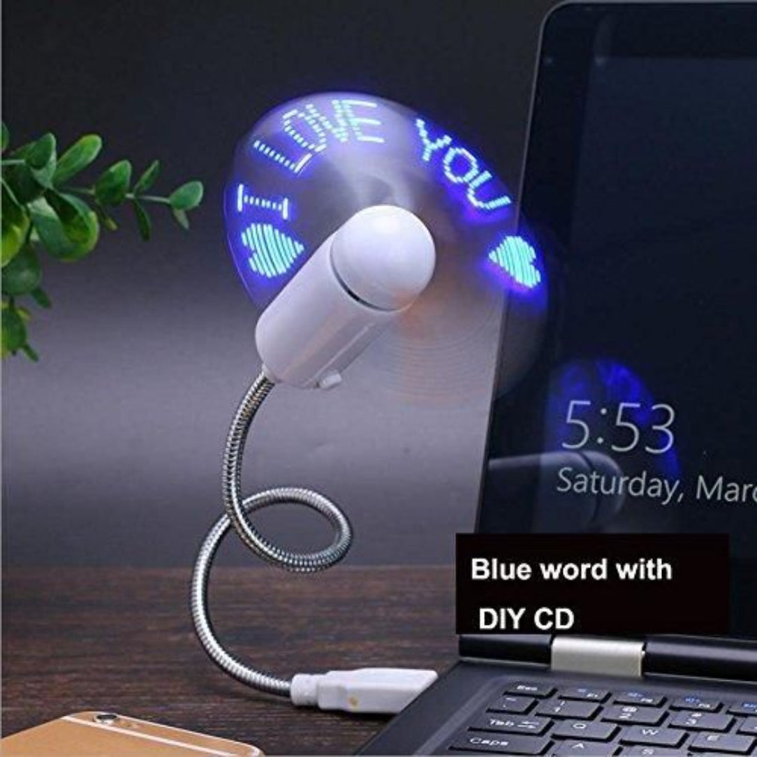 USB desk fan with LED display next to a laptop on a wooden surface.